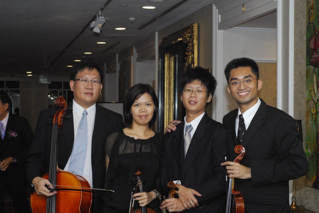 Four GraceNotes musicians with their instruments